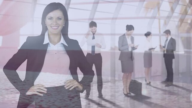 Vertical video: Posing woman in blazer hands on hips smiling in lobby, colleague checking watch