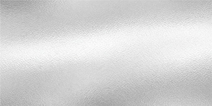 Textured silver surface creates a refined and elegant background for design. Capturing the interplay of light and shadow on the metallic surface.