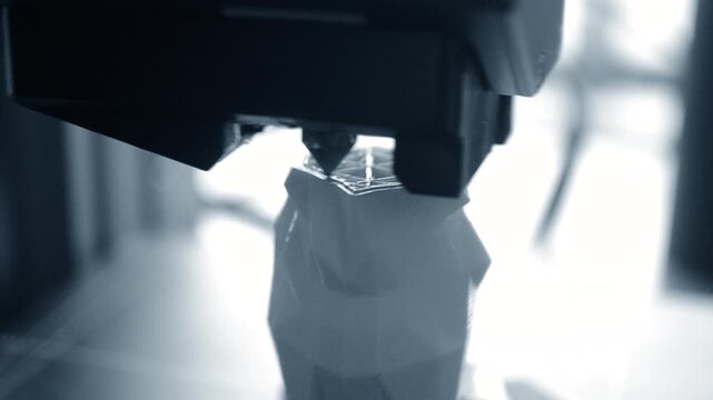 3D printer. 3D printer printing object close-up. 3D printer printing model blue color. Working 3D printer. Concept printing technology. New modern additive progressive technology. FDM technologies