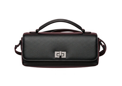 A black leather shoulder bag with a silver logo isolated on transparent background