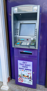 Thailand, Phuket - March 17, 2025: A purple Siam Commercial Bank (SCB) ATM on the street in Thailand. A modern banking terminal for cash withdrawals and financial transactions.
