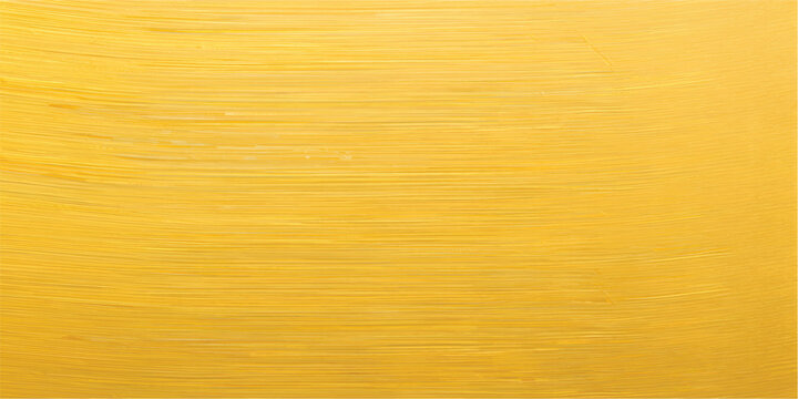 A vintage brushed gold metal texture with a rough grunge pattern on an antique yellow surface creates a weathered metallic backdrop for design