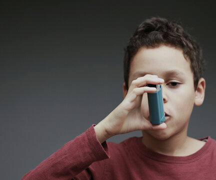 Asthma inhaler delivering fast, targeted relief to open airways and improve breathing during respiratory distress with people stock image stock photo