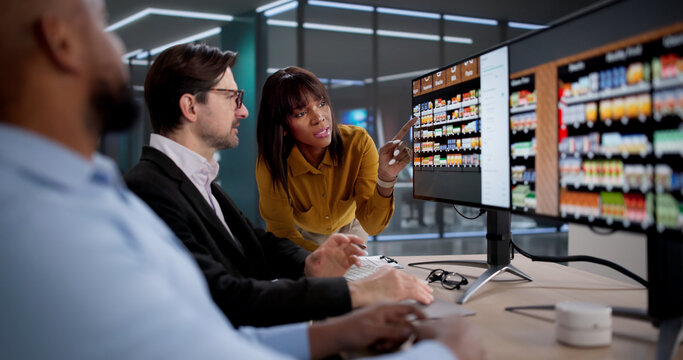 Diverse Team Of Retail Planners And Merchandisers Working Collaboratively