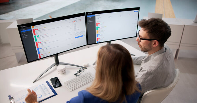 Team Overseeing Remote IT Support Tickets To Maintain System Compliance