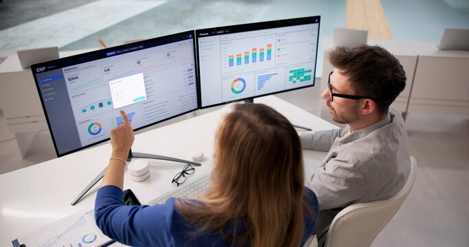 Corporate Team Working Together With Enterprise ERP Software For Financial