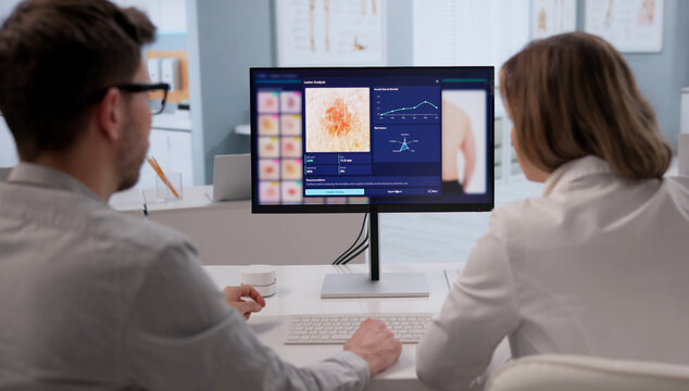 Dermatologist Thoroughly Inspects Male Patient's Skin