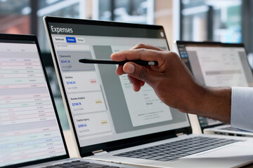 Young African Finance Manager Uses Software For Expense Tracking And Reporting