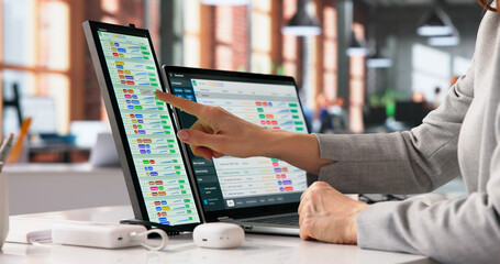 Healthcare Coder Analyzes Information On Monitor © Andrey Popov