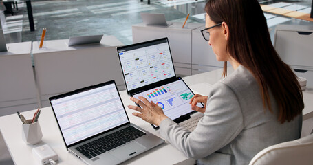 Fintech Specialist Examines Diverse Financial Dashboards