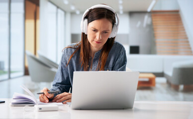 Confident Female Professional Hosting A Virtual Learning Session © Andrey Popov
