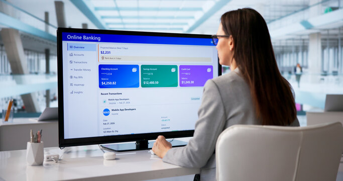 Woman Examining Digital Deposit Statements For Small Business Loan Application