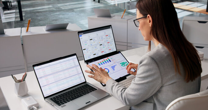Fintech Specialist Examines Diverse Financial Dashboards
