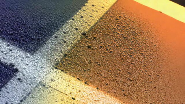 Microscopic view exhibiting quantum physics technology with intricate connections, creating a textured pattern in abstract blue, yellow, and orange hues