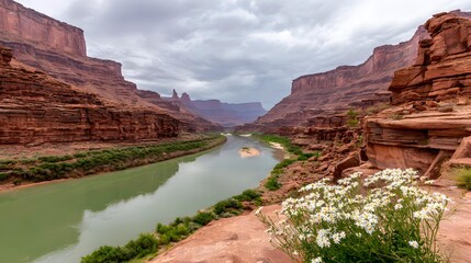 Naklejka premium valley with emerald water, orange cliffs, blooming wildflowers, expansive landscape view