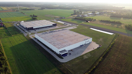 Fototapeta premium Industrial complex in rural area at dawn