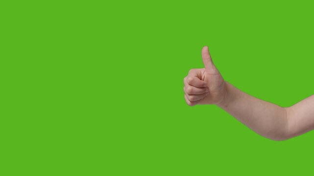 A person's hand makes a positive business communication gesture by pointing at you with one finger and giving a thumbs up sign for a successful okay symbol