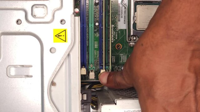 Close-Up of Computer Motherboard Repair with CPU Installation, Technician Hand Working on PC Hardware, RAM Slots and Circuit Board Detail, Technology Maintenance, IT Service Concept 4K Footage