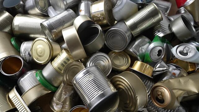 Huge pile of empty metal cans recycling and pollution concept