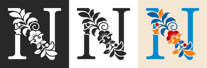 Naklejka premium Capital letter N with floral pattern. Letter A with flowers and leaves. Creative alphabet and decorated typography letter. Vintage patterned font. Isolated on white and black. Vector illustration