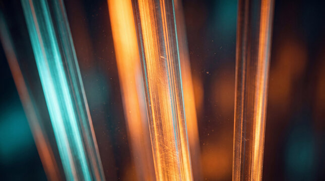 Detailed close-up of glowing glass-like rods illuminated with warm orange and cool blue light, abstract 3D render.