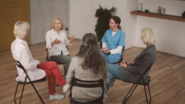 Group therapy for women, aged ladies communication with physician in clinic. Psychology and mutual support group, discussion better aging and anti-age treatments for stay healthy and active after 60