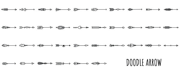 Hand drawn doodle arrow vector set. Black and white rustic, tribal, and boho style arrows with feathers and hearts for decorative design elements. © yunita