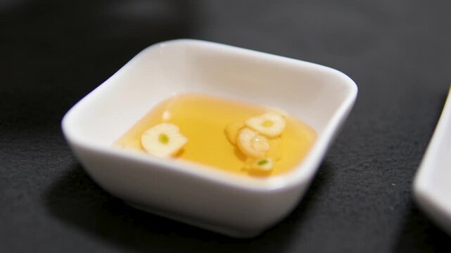 homemaker sauce preparation. fish sauce with garlic and pepper