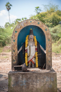 Traditional South Indian Village Guardian Deity Statue Muniswaran with Garland and Dhoti - Spiritual Hindu Religious Sculpture Representing Folk Tradition and Cultural Protection in India.
