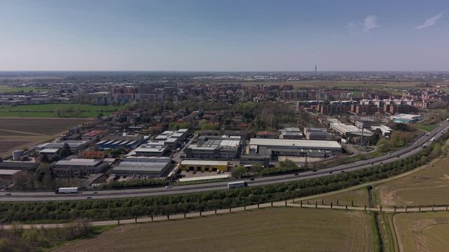 Aerial Overview of Modern Structures: An expansive aerial view showcases a modern cityscape where sleek buildings and infrastructure harmonize with the natural landscape.