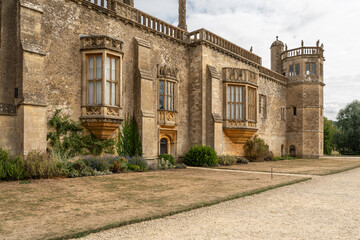 Obraz premium Ornate Tudor facade of Lacock Abbey with ornate bay windows, Wiltshire, England