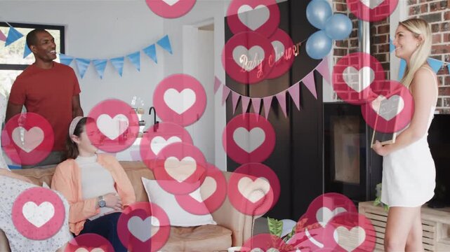 Vertical video: Holding board host in white dress leading baby shower game at home, hearts floating