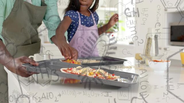 Dad handing bowl, guiding girl making pizzas by adding peppers on island, doodles appearing