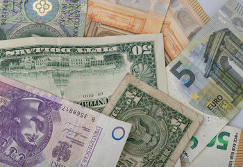 Obraz premium The world economy, money from various European countries, and the American continent up close, euro dolar