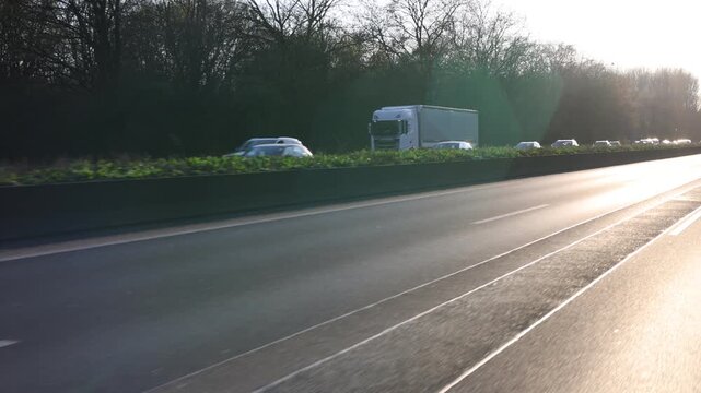 Adjacent lanes in traffic jam with sparkling reflections
