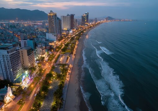 Aerial view of Da Nang city at twilight, Vietnam coastline.