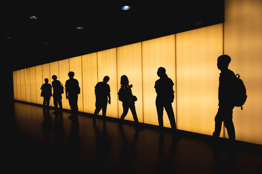 Silhouette people corridor light shadow urban modern walkway group reflection silhouette people corridor light shadow urban modern walkway group reflection