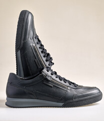 Luxurious pair of men's black leather shoes with laces and pull tabs