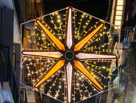 Vintage Street Sign, Decagonal Starshaped Lamp Above Alley Emitting Warm Yellow Light With Vintage City Charm