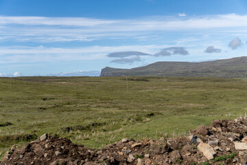 Obraz premium The Isle of Skye, is a large and scenic island in the Inner Hebrides of Scotland.Neist Point Lighthouse). Located at Duirinish Peninsula, near Glendale, is known for its imposing cliffs.