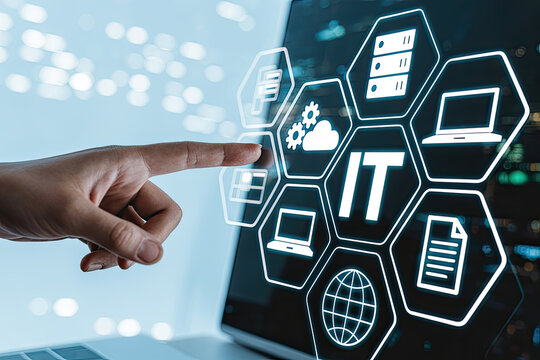 A person's finger pointing at an IT icon on a laptop screen, symbolizing the digital world