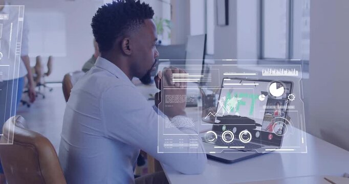 Man at desk joining remote call, viewing NFT deck spawning HUD overlays over laptop showing data