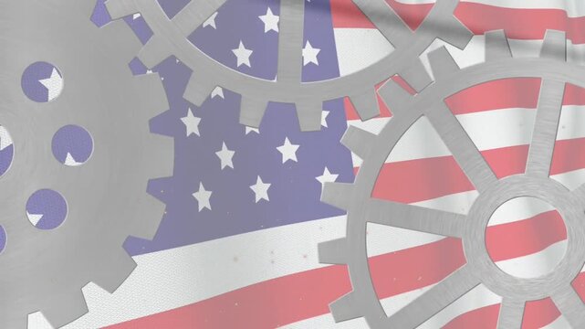 Vertical video: Rotating three gears after frame advance over American flag, casting slow shadows