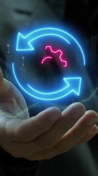 Businessman showing motion graphic animation of neon arrow is turning around neon gear factor. Dynamic, running, working, team work and success for business concept.