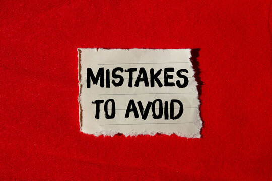 Mistakes to avoid message written on ripped torn paper background. Conceptual Mistakes to avoid symbol. Copy space.