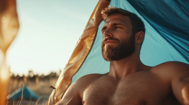 A serene moment captured of a bare-chested man sitting inside a tent, reflecting on the peaceful sunset, surrounded by nature's tranquility and warm colors.