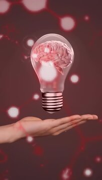 Vertical video: Dropping bulb into palm, hand holding hovering brain bulb over red net to show idea