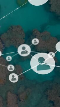 Vertical video: Dots popping avatars growing linking lines over turquoise reef showing tech network
