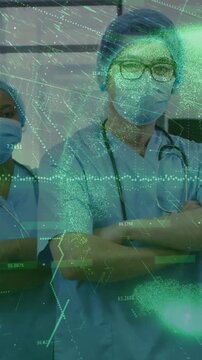 Vertical video: Medical lead raising and crossing arms as neon data overlay sweeping, showing calm
