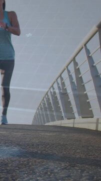 Vertical video: Woman runner entering bridge frame, streaks showing tracker, steps marking fitness